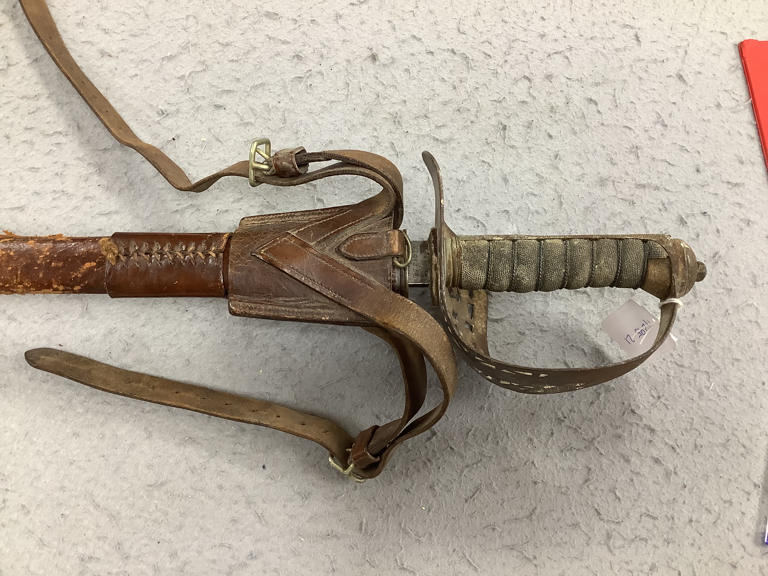 A Victorian 1897 pattern infantry officer's sword, maker Robert Mole & Sons, Birmingham, marked War and India offices, with scabbard and leather hanger, blade 82cm